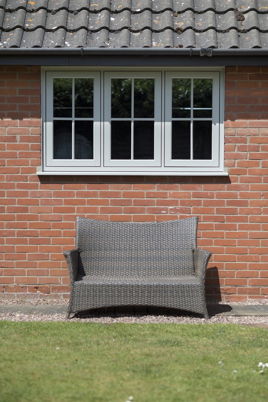 Residence 7 flush casement window above a garden bench