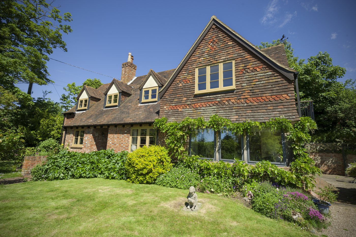 Residence 9 windows across a large heritage garden elevation