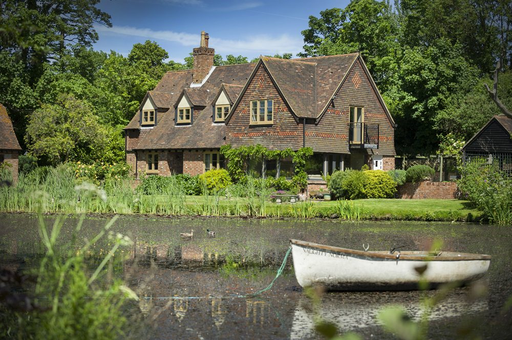 Residence 9 heritage flush windows on a large character home beside a lake
