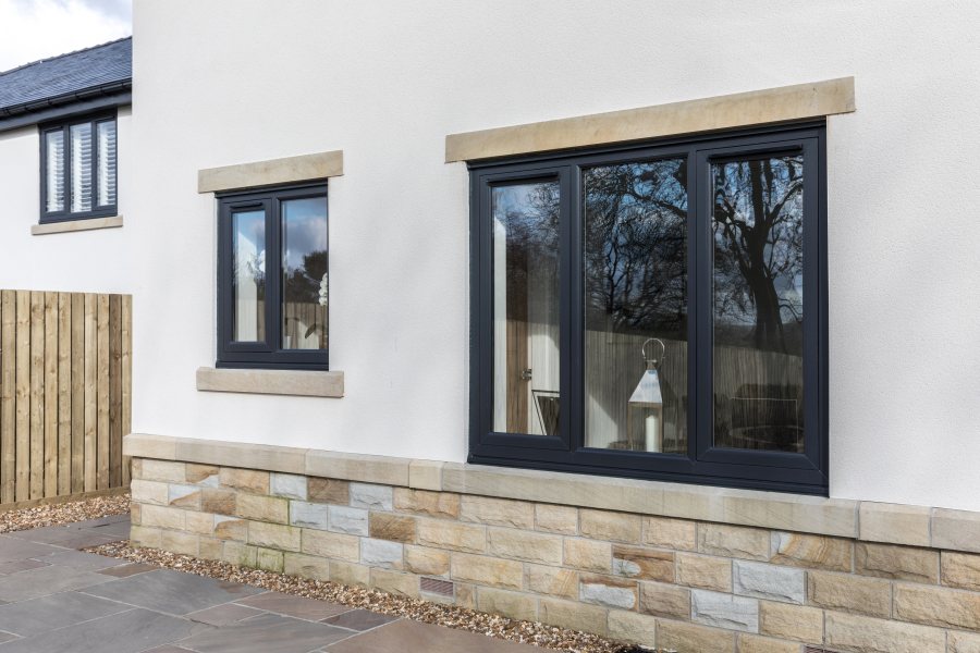 Liniar Flush Sash windows on a rendered home exterior