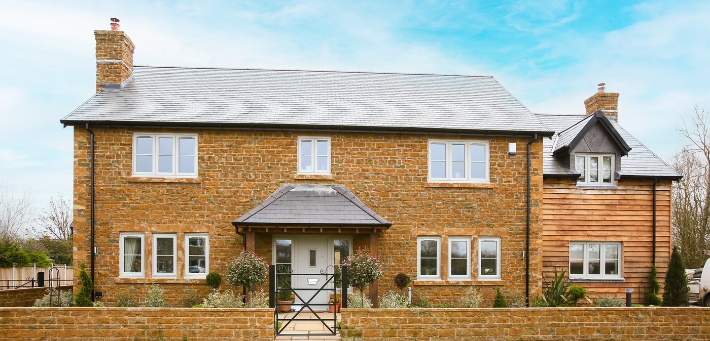 Liniar Resurgence flush sash windows on a stone home exterior