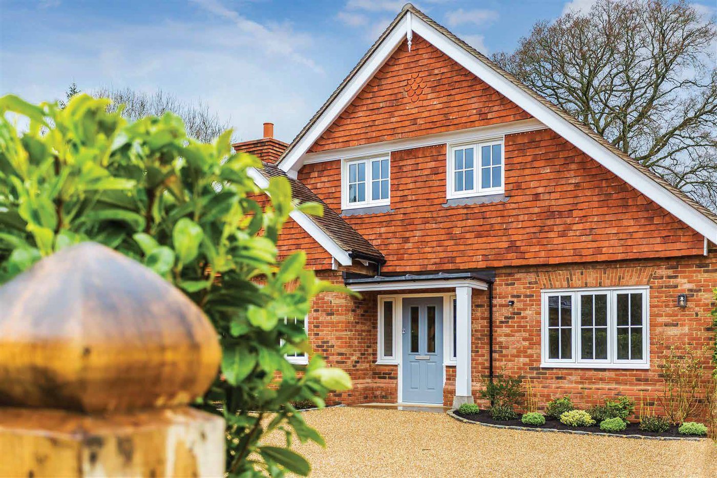Timberlook white flush sash windows on a red brick heritage home