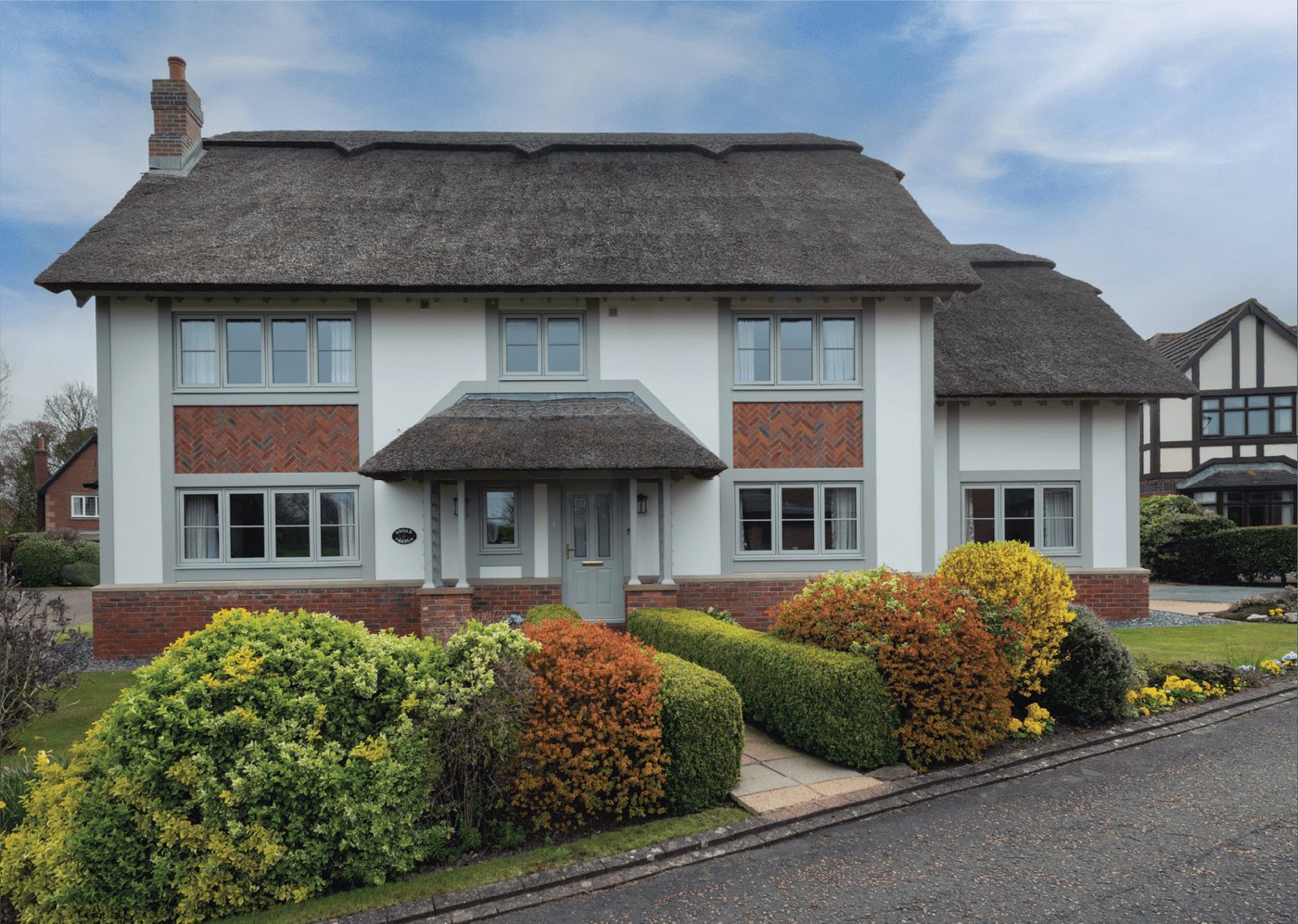 Timberlook Heritage Flush Sash windows on a thatched character home